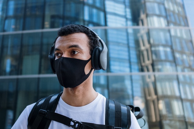 Man with face covering outside