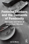 Cover of "Feminist Thinkers and the Demands of Femininity" with an ashtray on a wooden table, evoking a contemplative, intellectual tone.