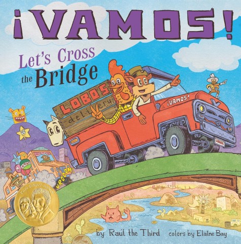 Illustrated cover of "¡Vamos! Let's Cross the Bridge" features a cheerful wolf and rooster in a red truck labeled "Lobos Delivery," driving over a bridge. Playful, colorful art with lively scenery and a gold award sticker.