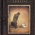 Cover of "The Arrival" by Shaun Tan. A sepia-toned image shows a man in a hat and suit, holding a suitcase, curiously facing a small, white creature.