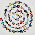 Colorful collage spiral on textured white background with varied art pieces. Text reads "Vitamin C+" and "Collage in Contemporary Art." Creative and dynamic.