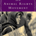 Cover of "Women and the Animal Rights Movement" by Emily Gaarder. A young person in a hood holds a protest sign, conveying determination. Purple accents.